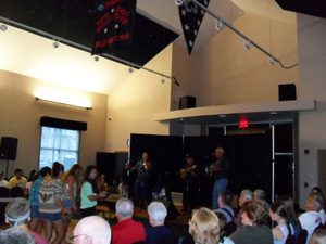 Enjoying more good music and line dancing at the Country Music Highway Museum.