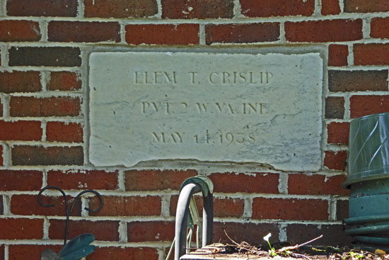Name plate on one of the out buildings.
